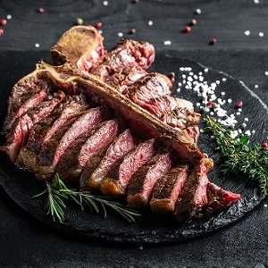 Sliced Wagyu porterhouse steak with rosemary